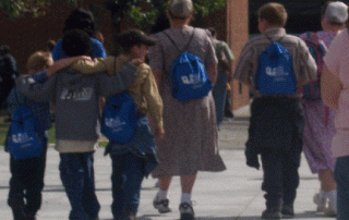 Kids walking with backpacks on